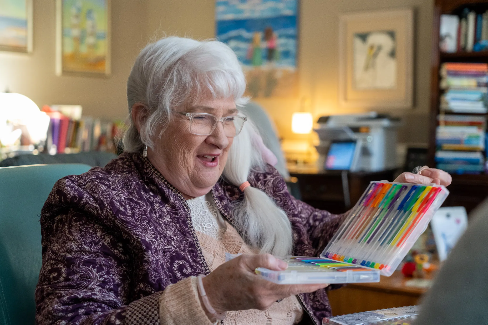 Joan choosing which marker to use for coloring.